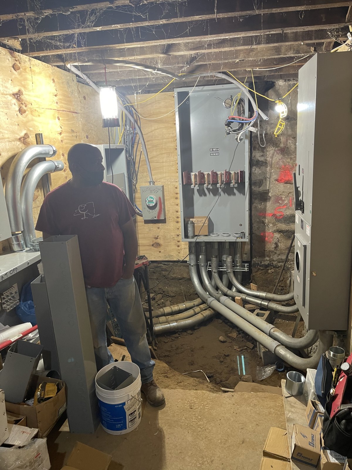 Electrician at an electrical panel