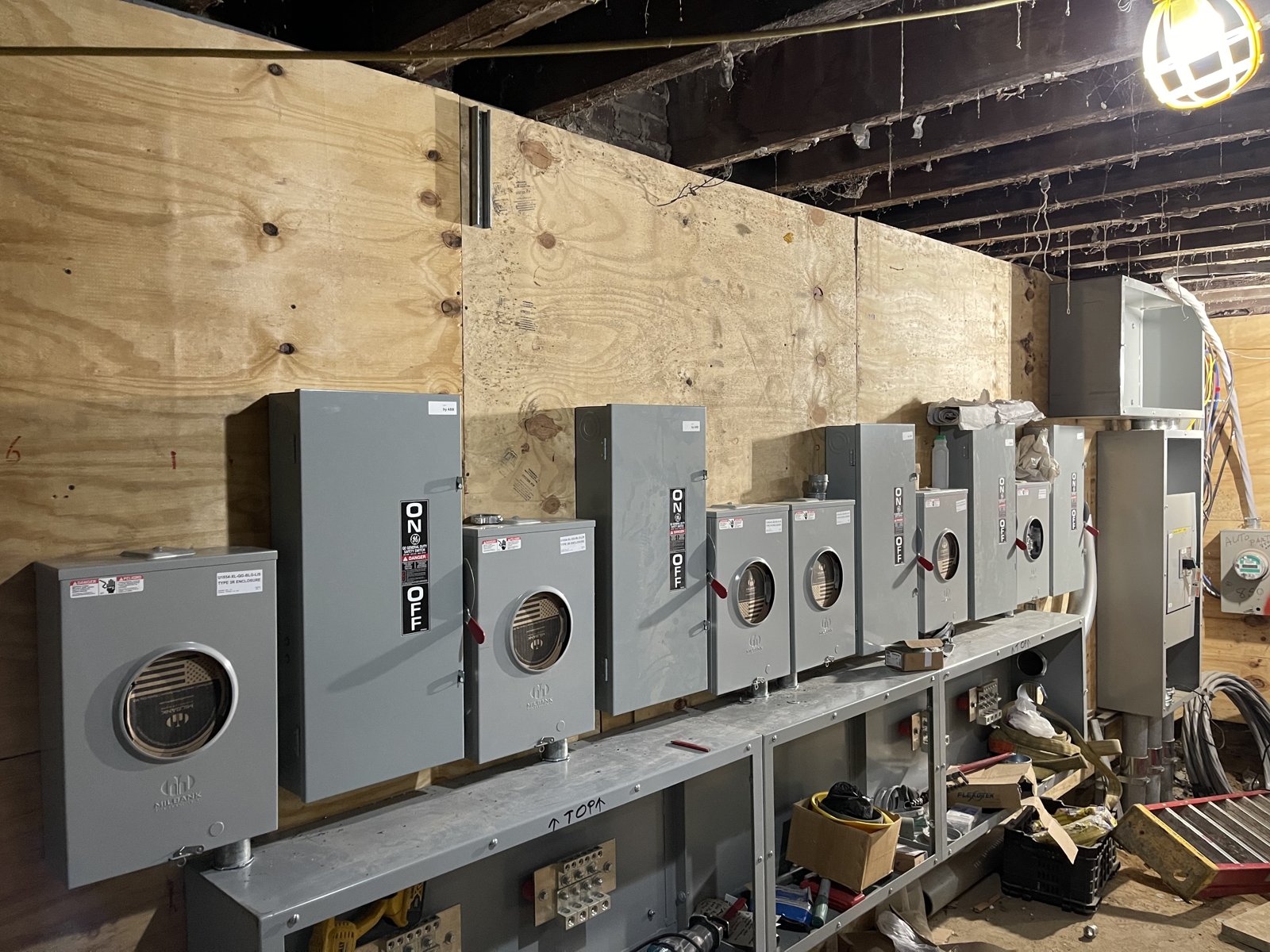 Row of electrical metering enclosures