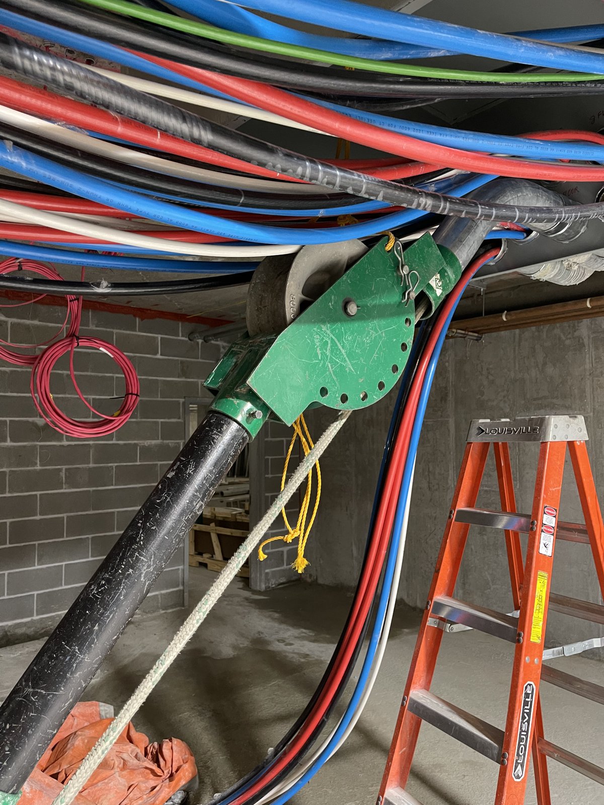 Color-coded wiring above an electrical enclosure