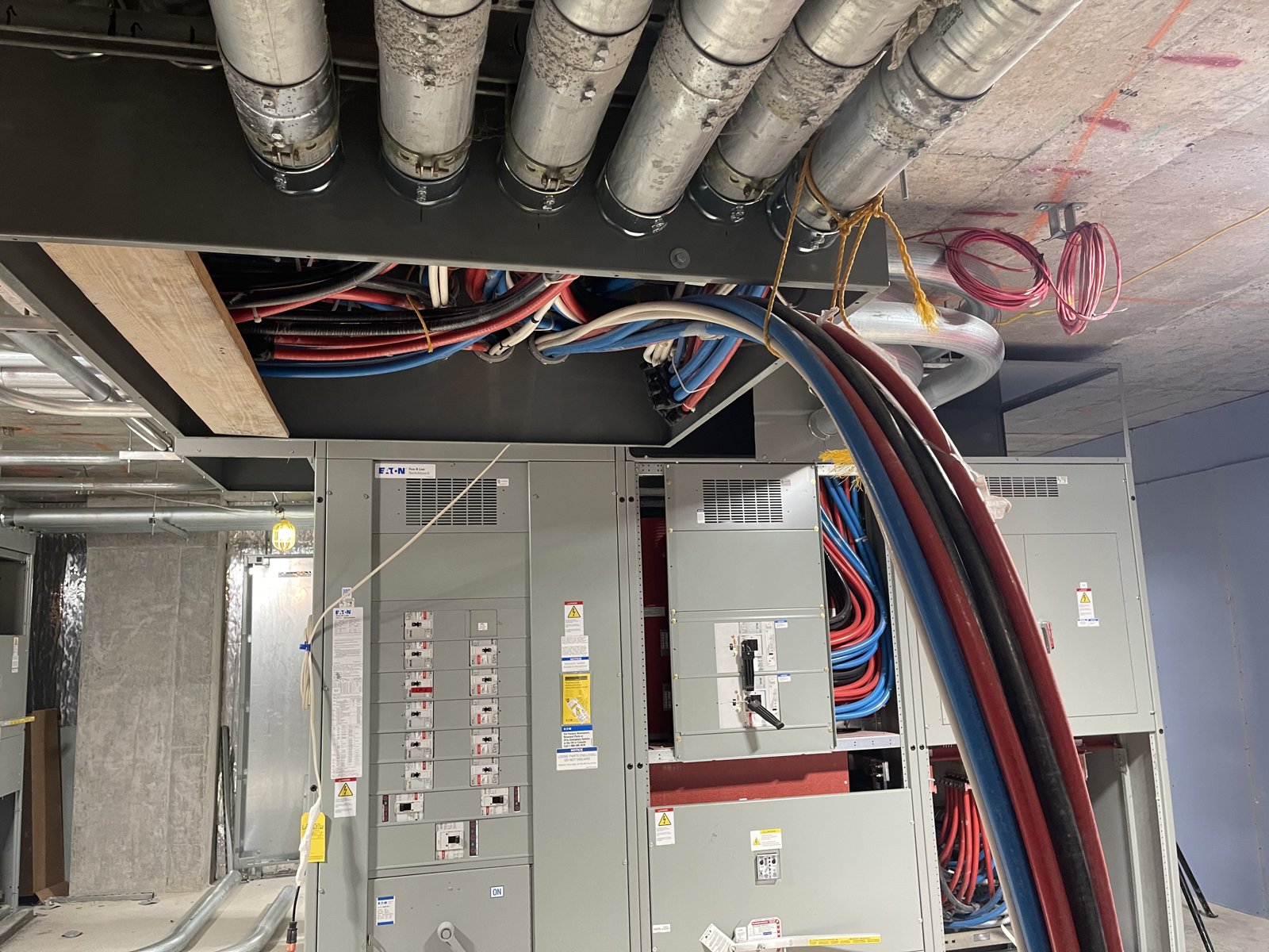 Overhead feeder routing to electrical equipment