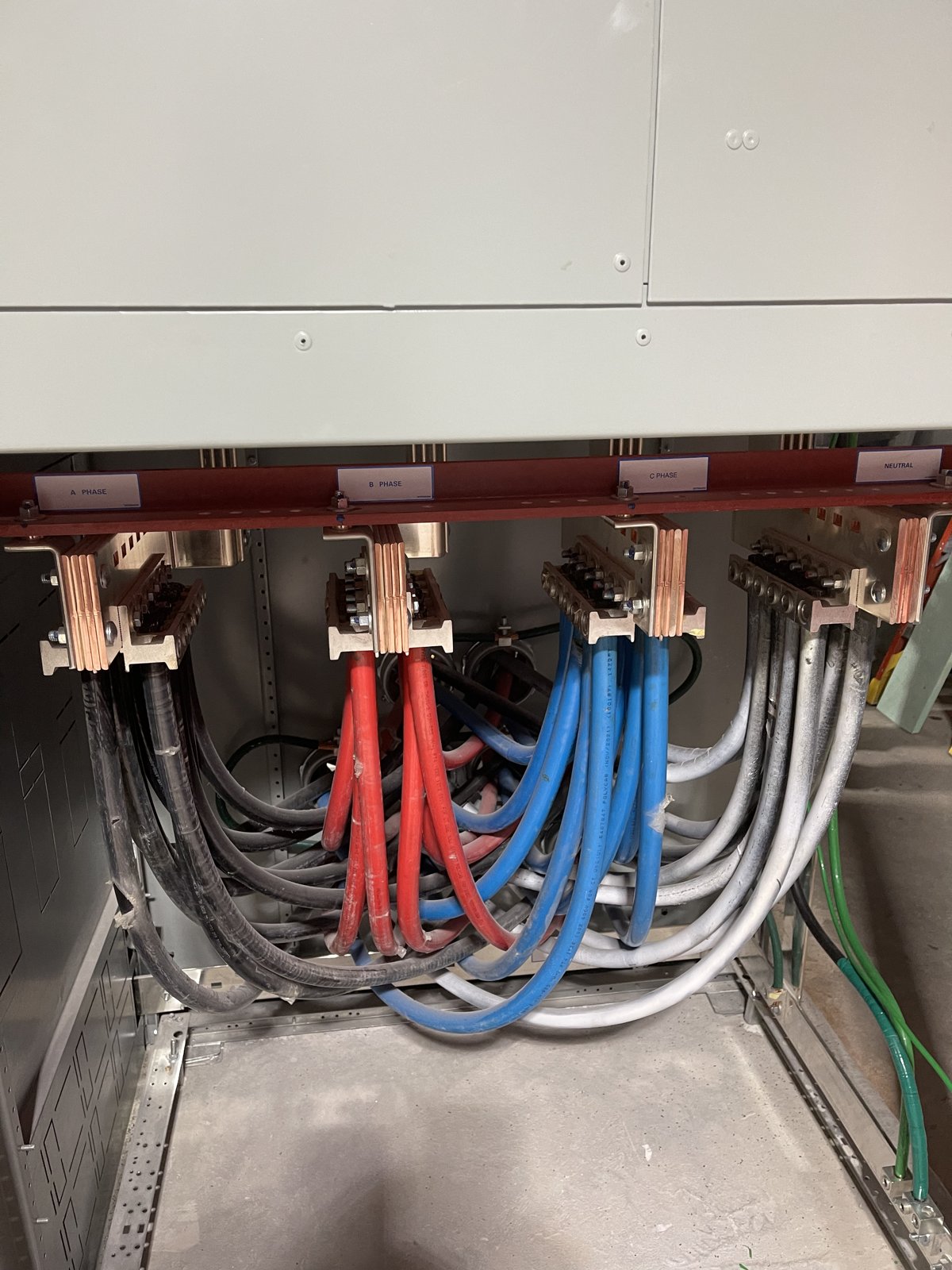 Wiring connections below electrical equipment